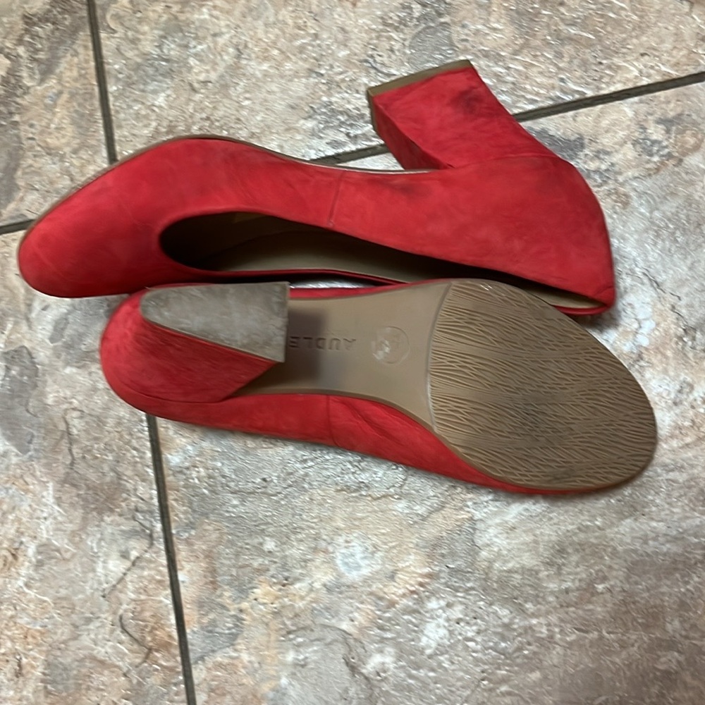 Red suede Audrey brand pumps.
